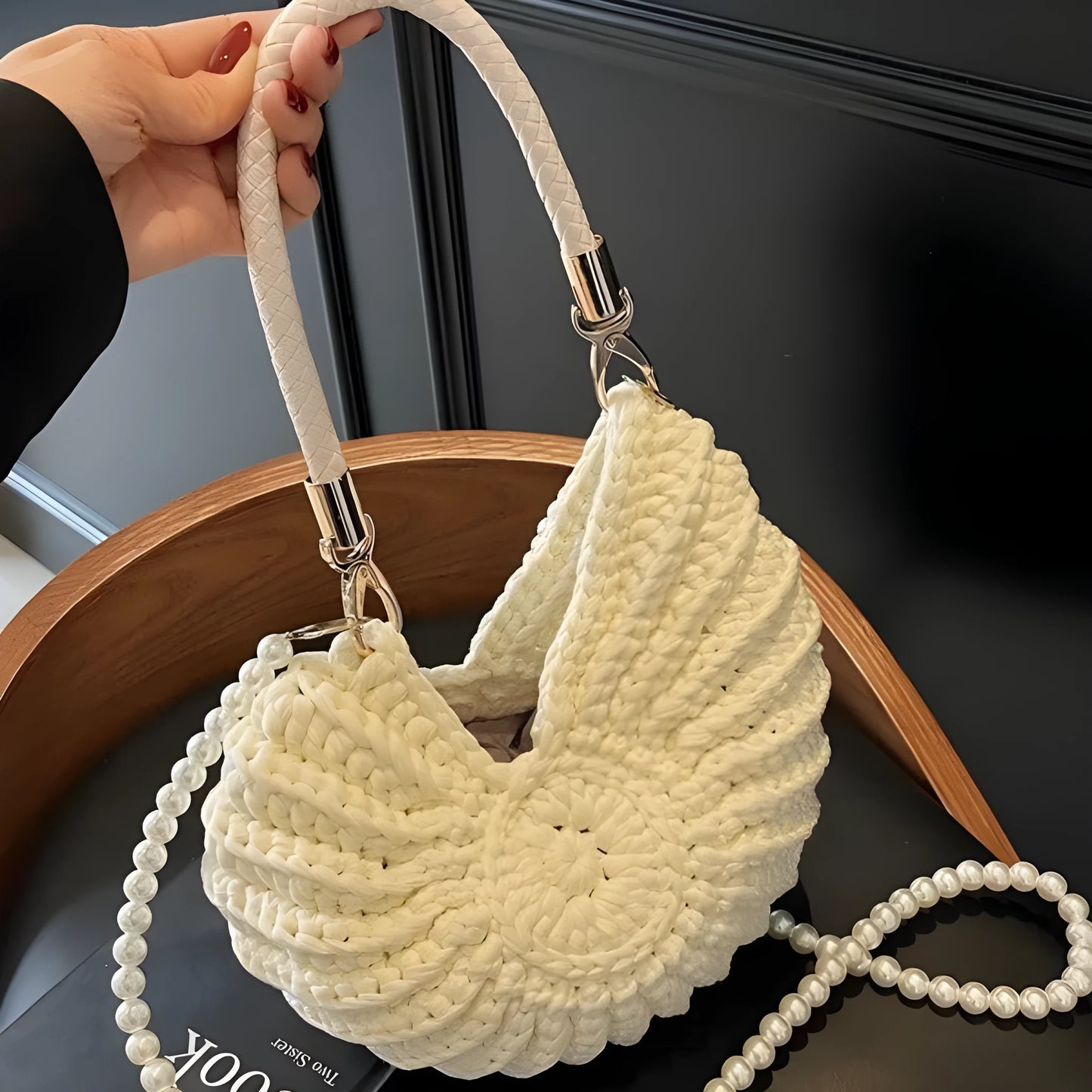 Handmade woven cloth bag with double shoulder straps in shell shape showing open pocket design