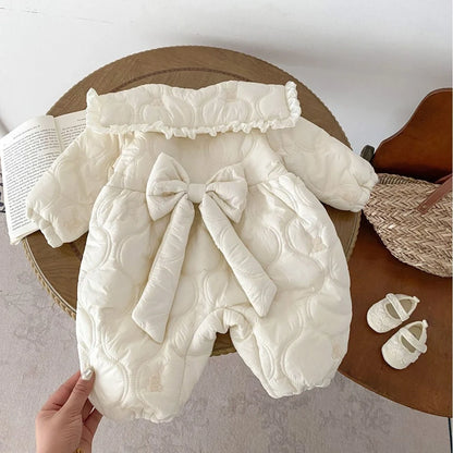 Newborn in light beige fleece-lined quilted cotton jumpsuit with single-breasted closure