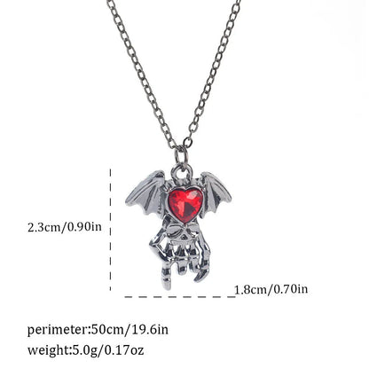 Gothic style zinc alloy necklace with bat pendant on a silver chain against dark background.