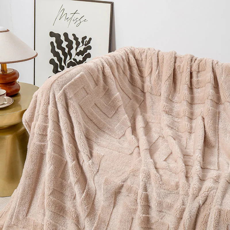 Thick square coral fleece blanket in a modern style, shown in one of five colours including lake blue or khaki.