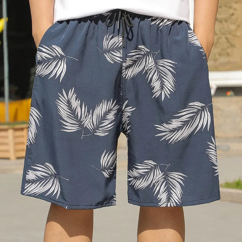 Man wearing loose-fitting striped beach pants made from quick-dry ice silk fabric.