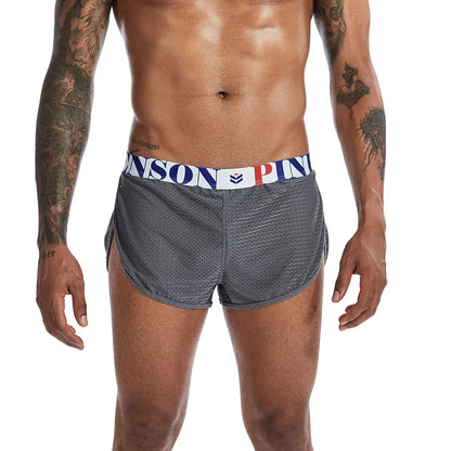 Breathable mesh men's boxer briefs in black, shown laid flat