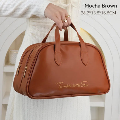 Leather travel toiletry bag with dry-wet separation compartments in caramel mocha colour with letter detailing