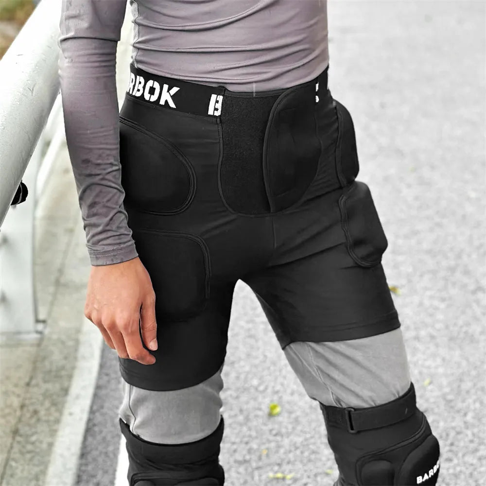 Black roller skating hip pad pants with NBR foam protection panels for skateboarding
