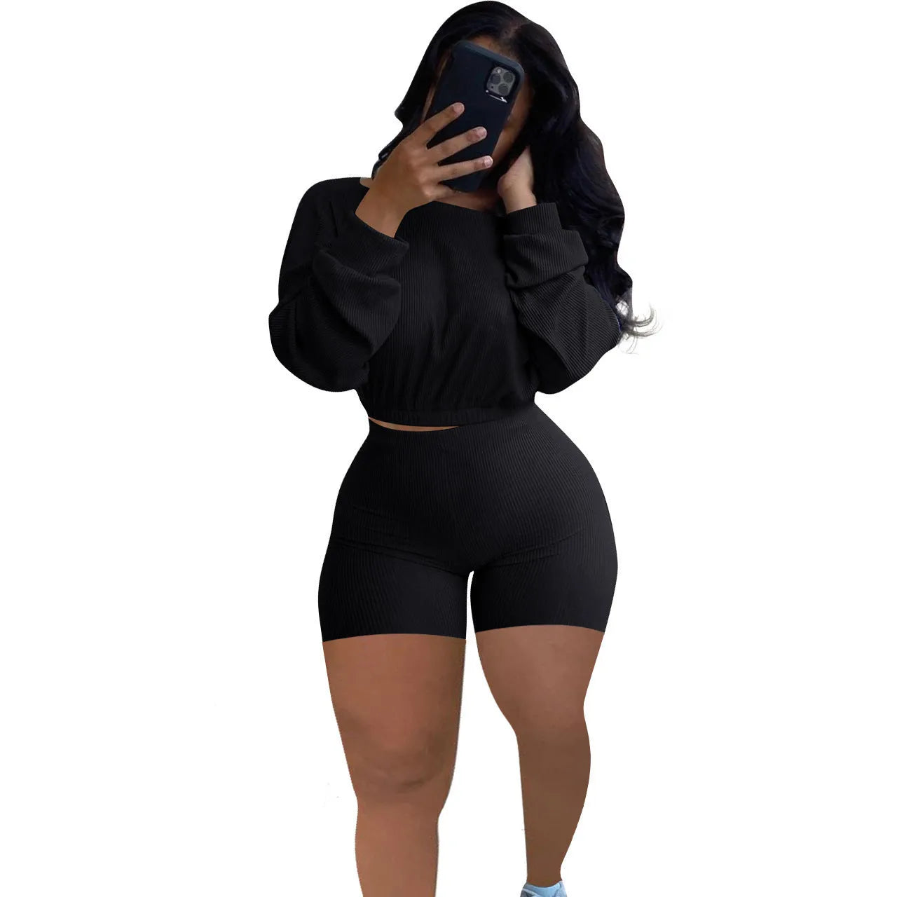 Women's long sleeve off-the-shoulder top and shorts two-piece set in a solid colour.