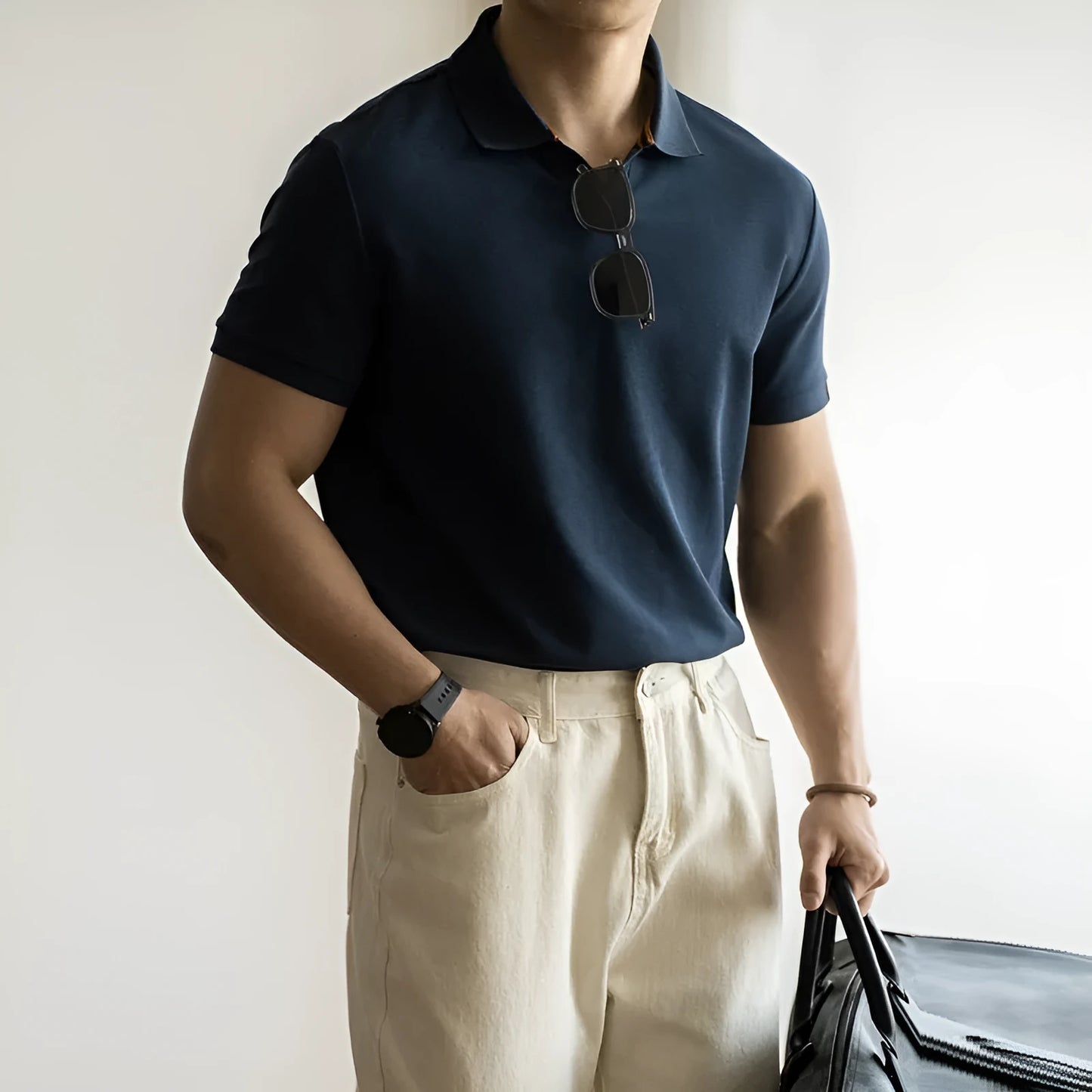 Light blue cotton polyester short-sleeved polo shirt on a hanger.