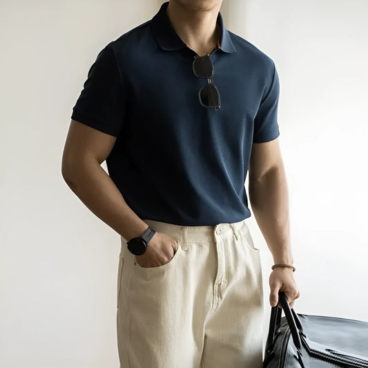 Light blue cotton polyester short-sleeved polo shirt on a hanger.