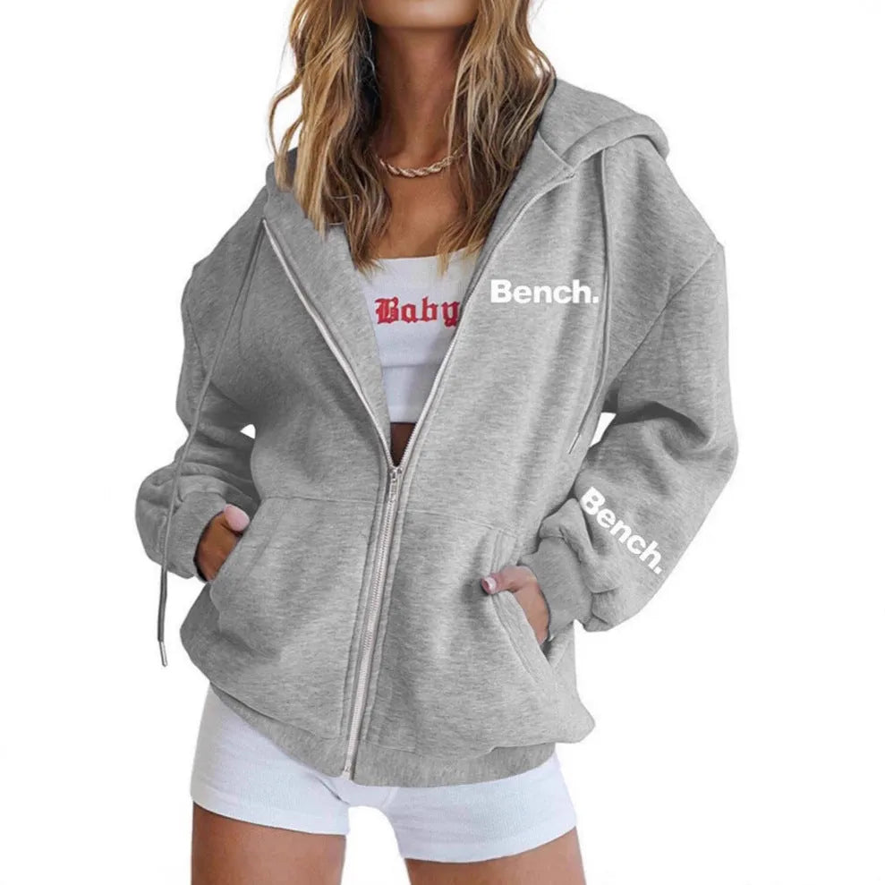 Grey loose fit men's sweater coat with a front zipper, modelled casually.