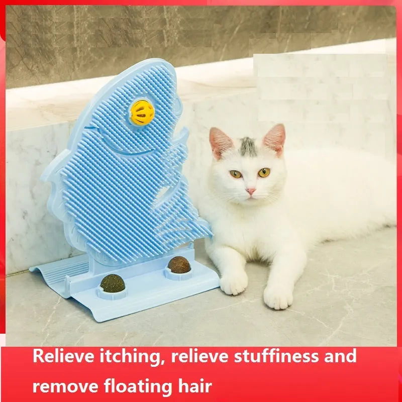 Blue fish-shaped cat wall scratcher with grooming brush, two catnip balls, and bell on white base