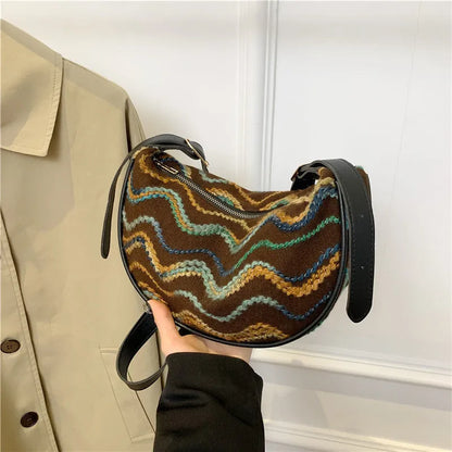 Women's woven straw crossbody bag with internal phone and file pockets in various colours.