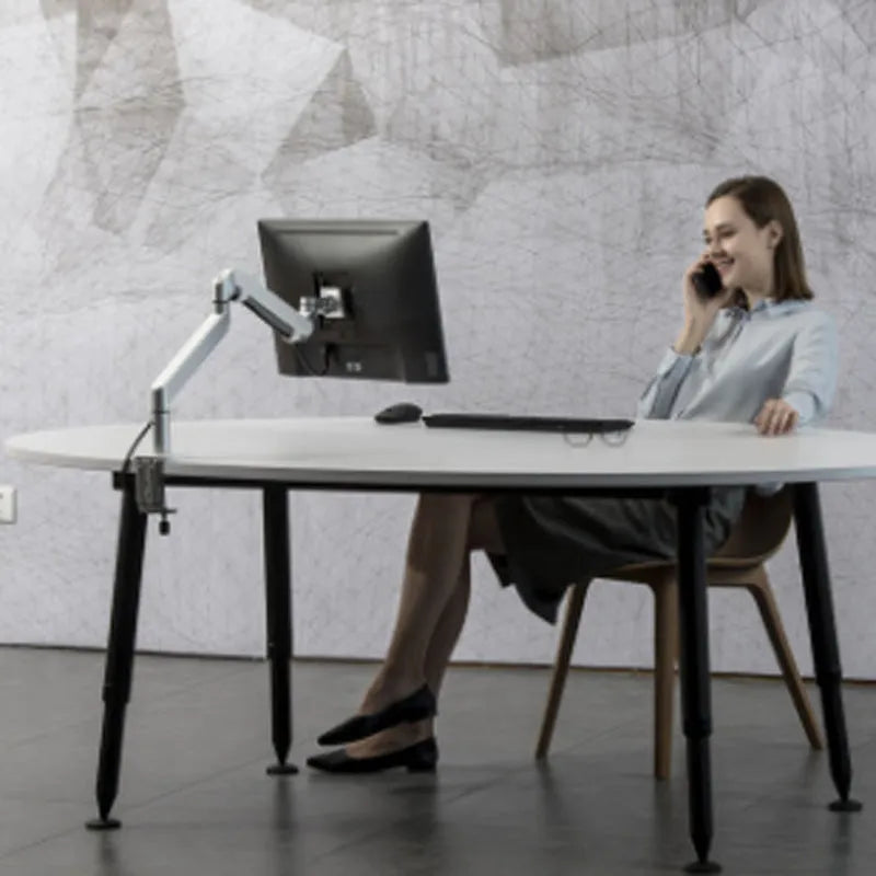 Silver aluminium alloy laptop stand holding a notebook on a desk