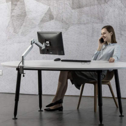 Silver aluminium alloy laptop stand holding a notebook on a desk