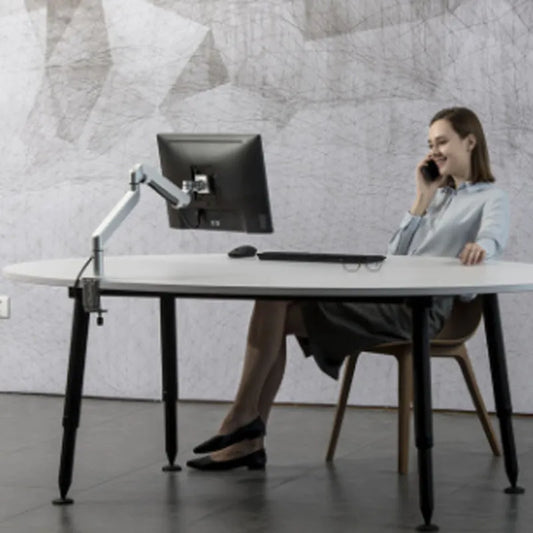 Silver aluminium alloy laptop stand holding a notebook on a desk