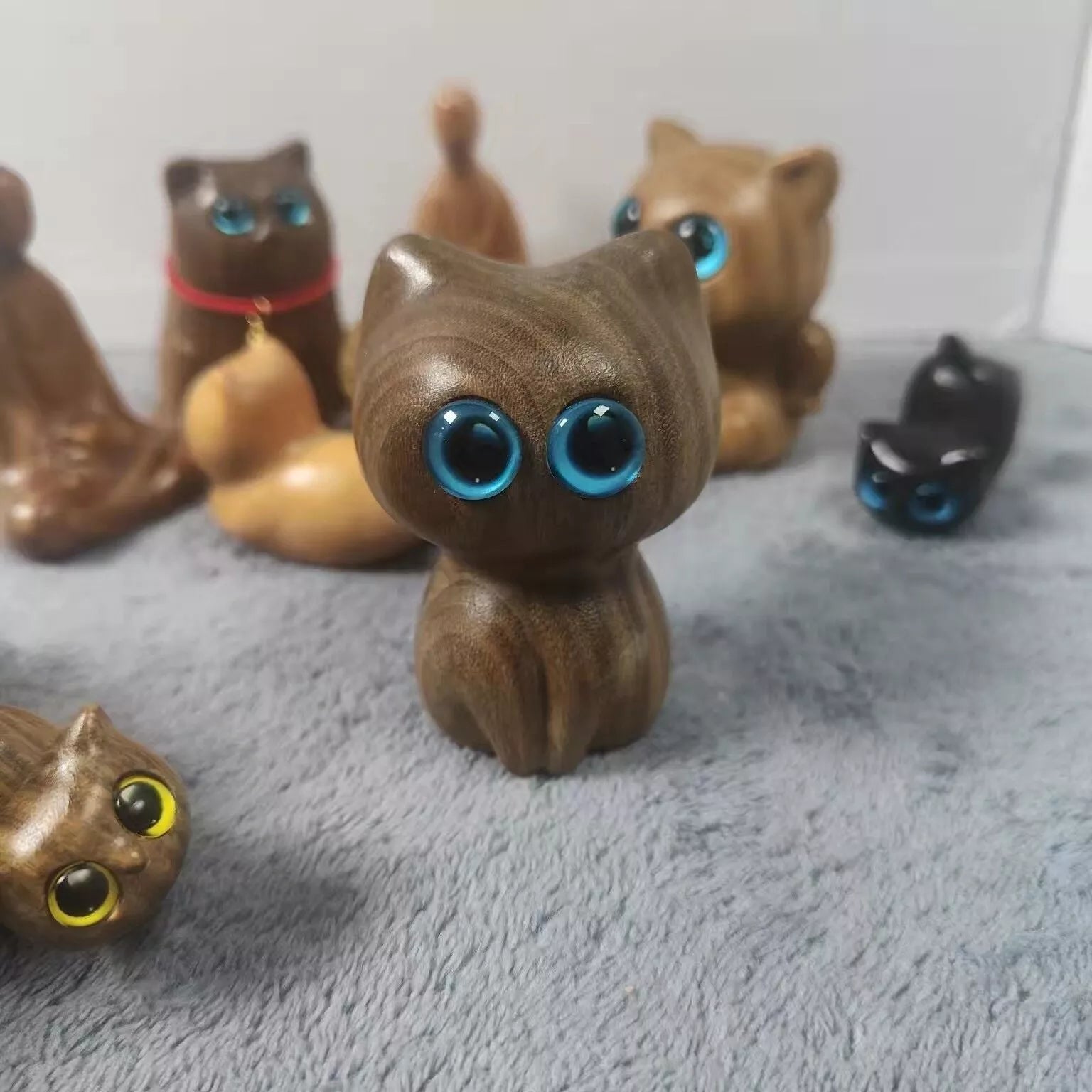 Handmade green sandalwood kitten ornament with unique design