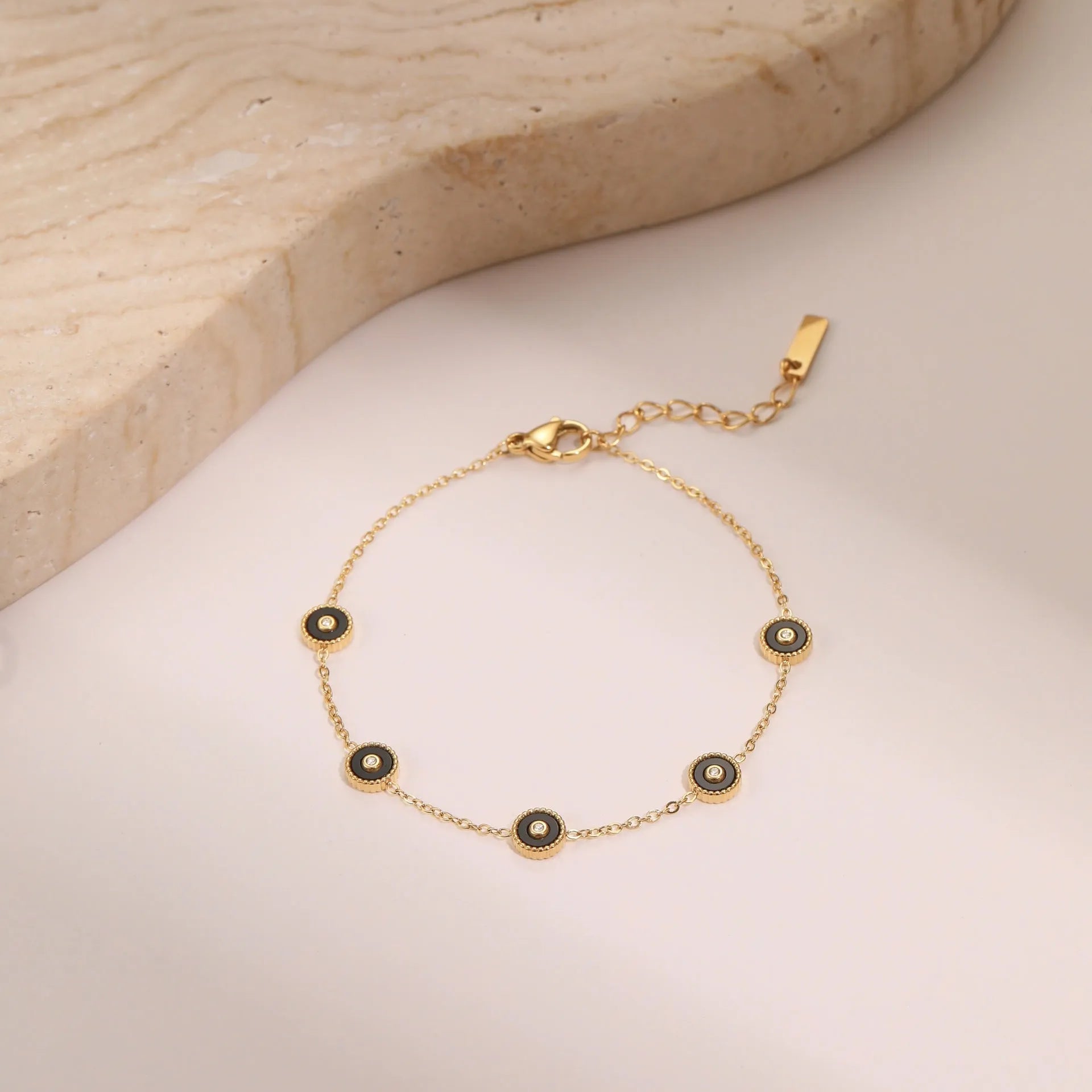 Women's stainless steel bracelet with 18K gold plating and geometric design