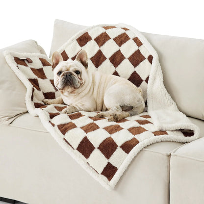 Blue and white patterned waterproof dog blanket on furniture showing cloth texture