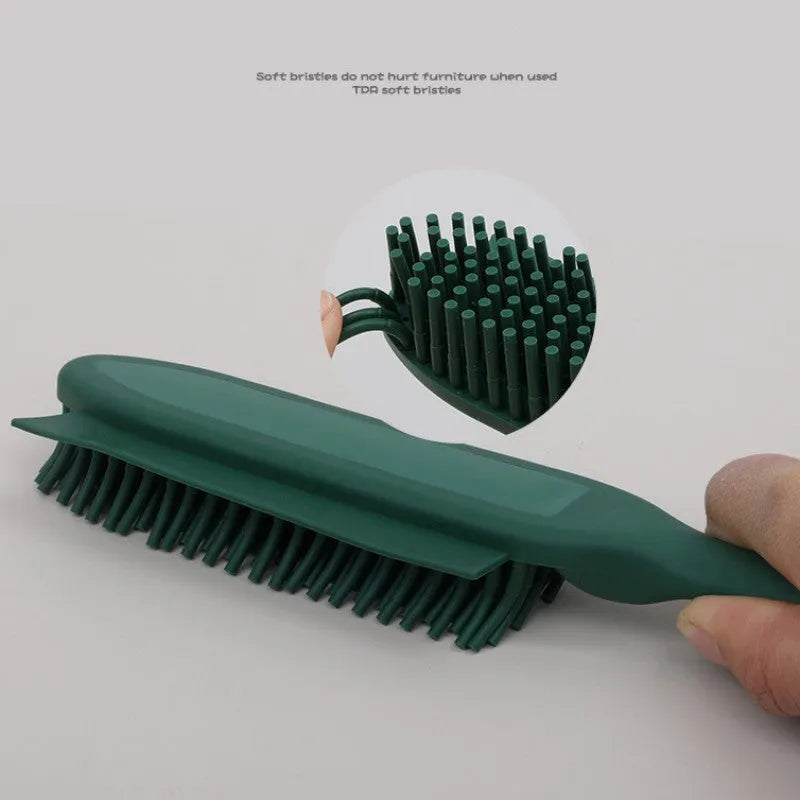 Green silicone pet grooming brush with flexible bristles for removing hair from cats, dogs and furniture