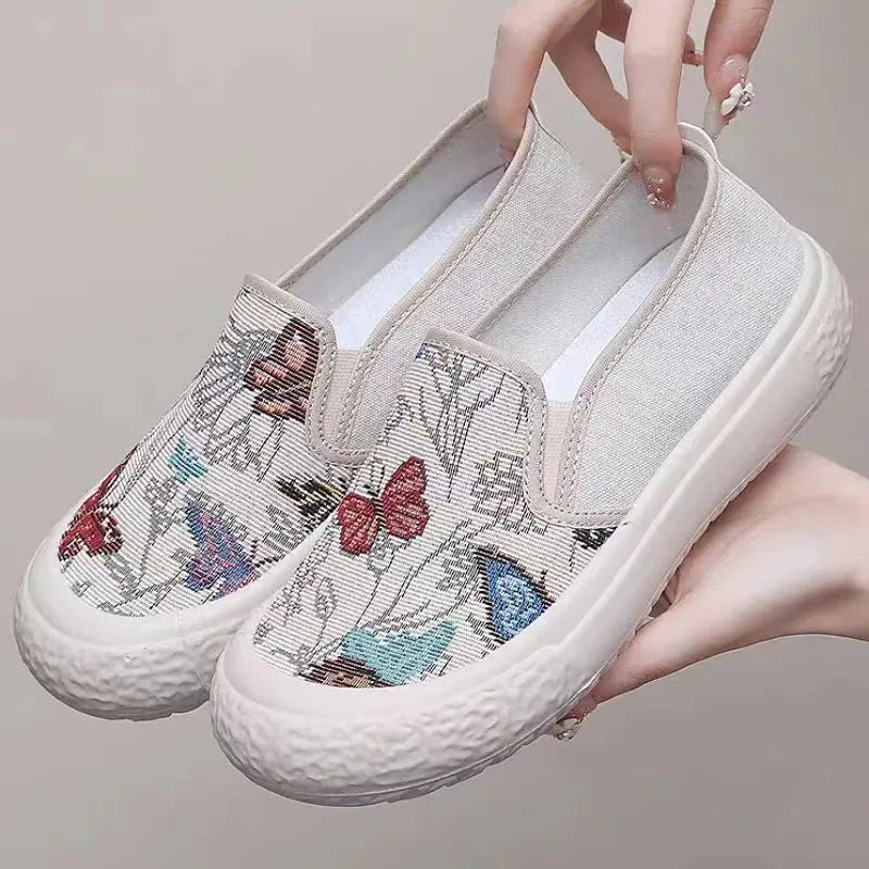 Women's classic canvas slip-on shoes with plastic soles in black and white colour options