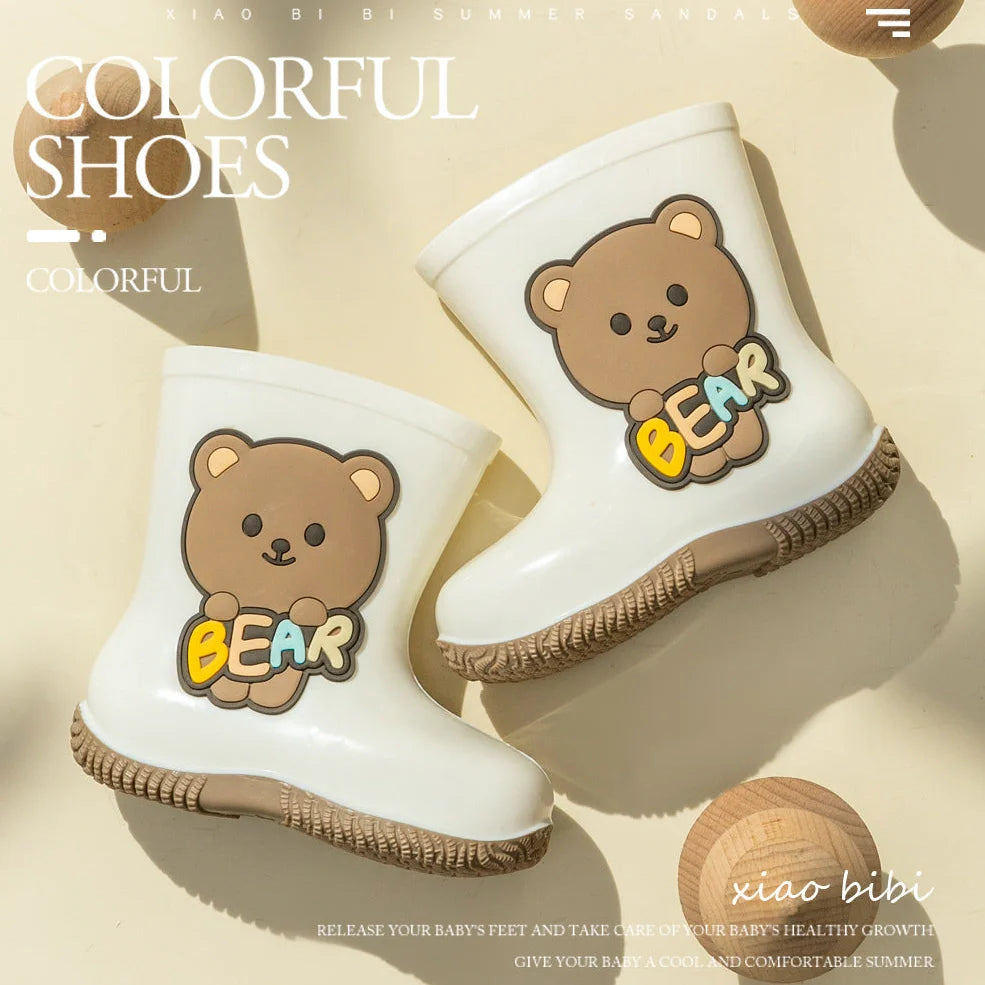 Children's PVC rain shoes with cartoon bear design showing waterproof construction and low heel