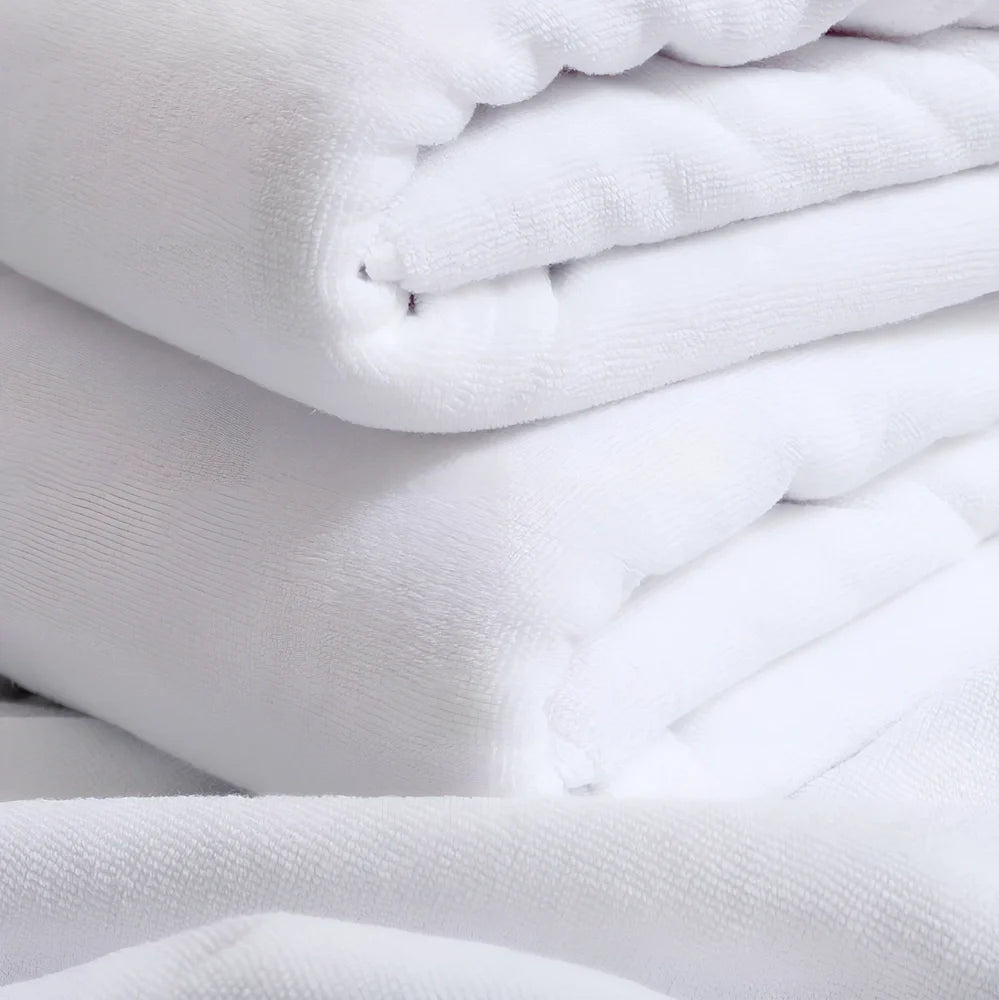 White hotel bath towel with thickened 100% cotton construction showing texture detail
