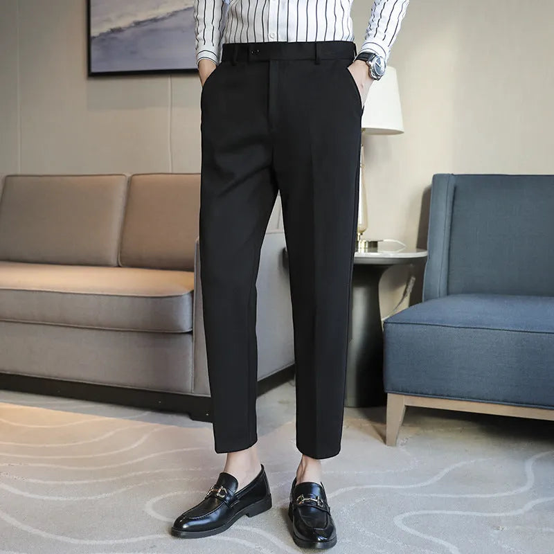 Straight-leg brown corduroy trousers with elastic waistband and slim fit design