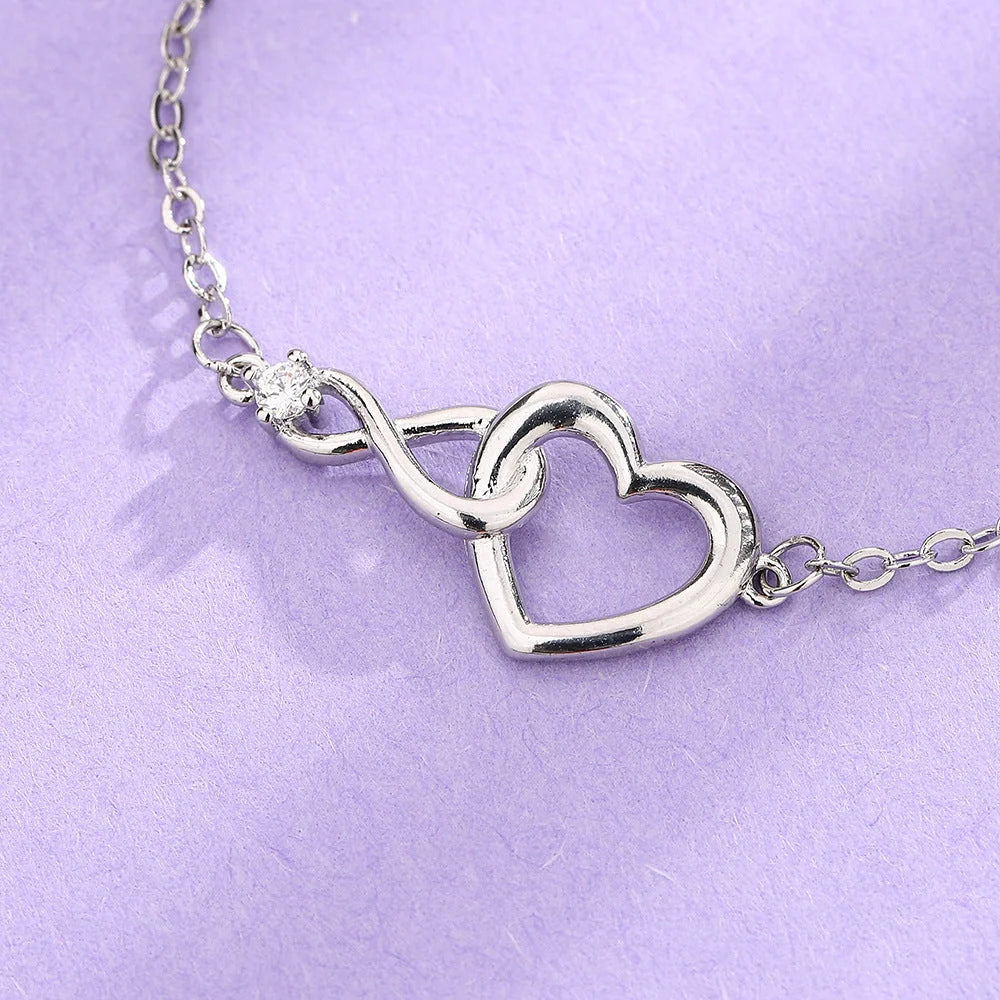 Heart-shaped bracelet with 3A zirconia in platinum and golden colors