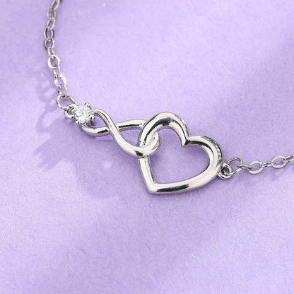Heart-shaped bracelet with 3A zirconia in platinum and golden colors