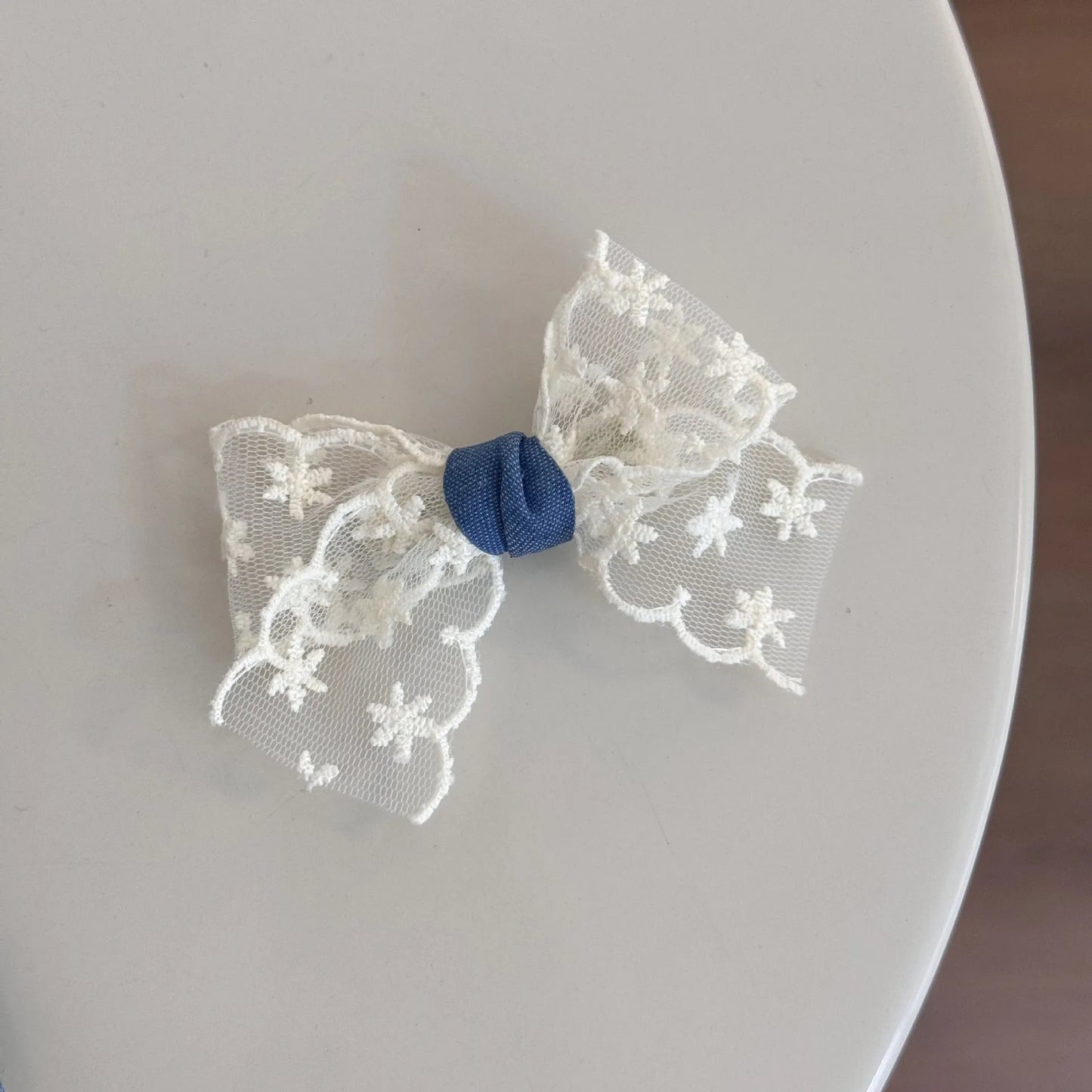 Cloth barrette hairpin set showing blue bow, beige lace, and pearl butterfly designs