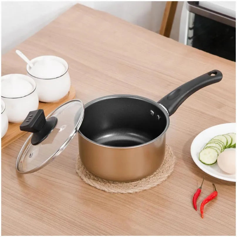 Cast iron three-piece cookware set showing a soup pot, milk pot, and wok with non-stick coating.