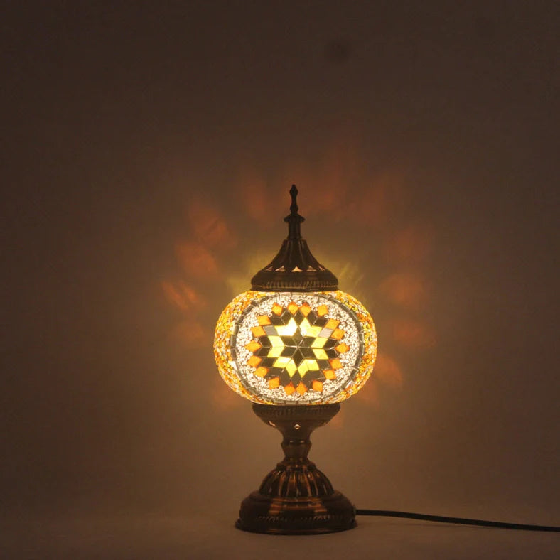 Glass table lamp with 150mm diameter shade and 330cm cord on wooden surface