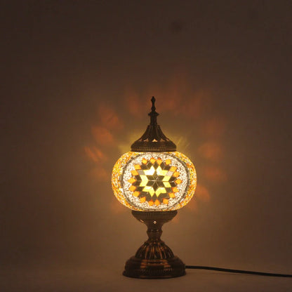 Glass table lamp with 150mm diameter shade and 330cm cord on wooden surface