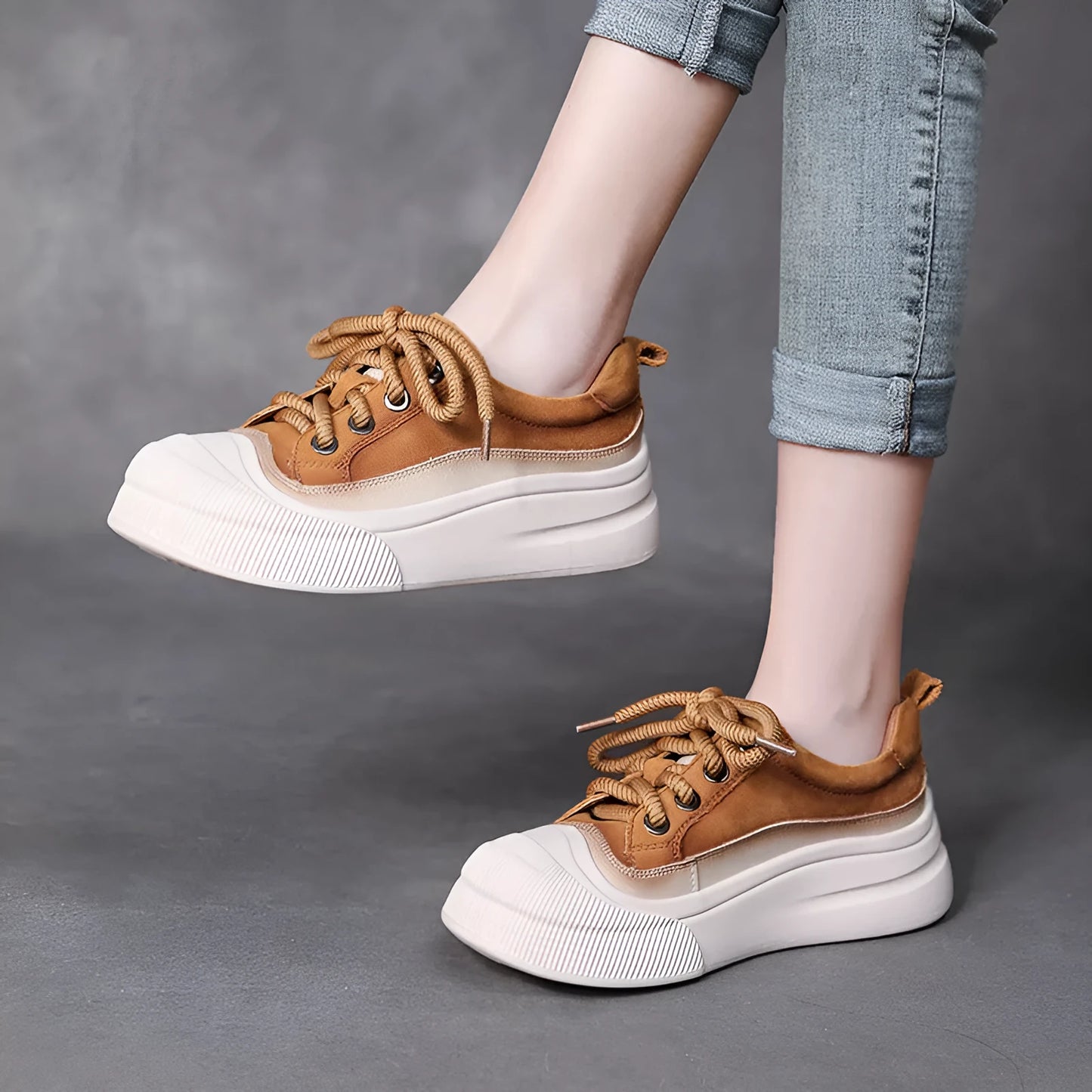 Women's brown leather lace-up casual shoes with round toe and rubber sole on white background