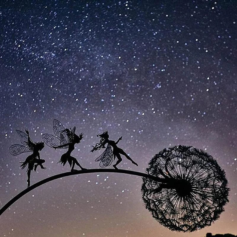 Enchanting metal fairy garden sculptures in the shape of fairies and pixies dancing on dandelions, designed for year-round outdoor or indoor display