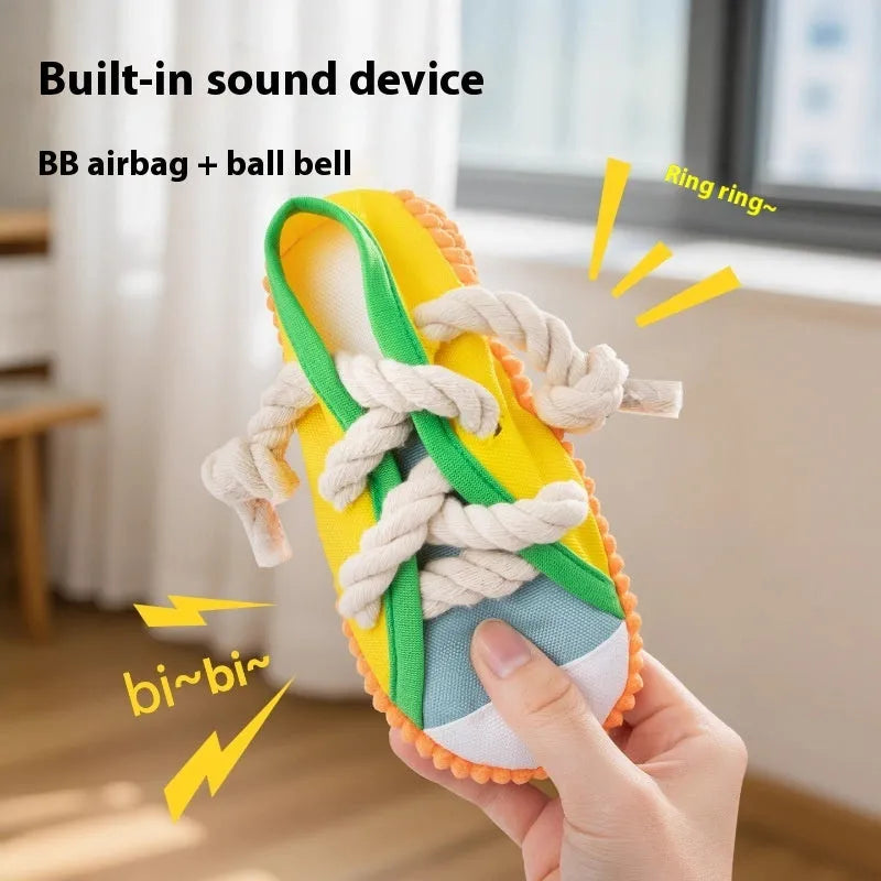 Durable plastic dog chew toy in slipper shape with bends, in yellow, black, or blue.