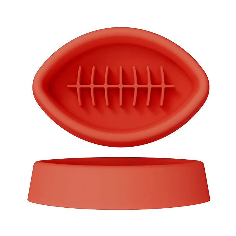 Blue silicone pet slow feed bowl with suction cup base on kitchen floor