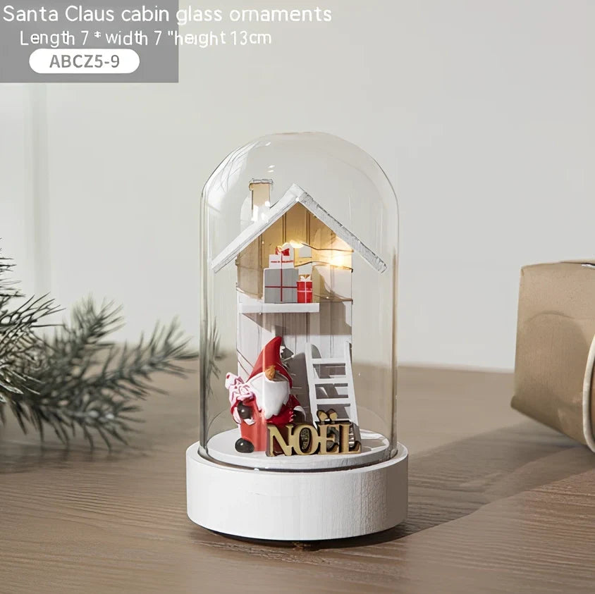 Small 15 cm glass reindeer night lamp in white snowman cabin style casting 100 lumen festive glow on table