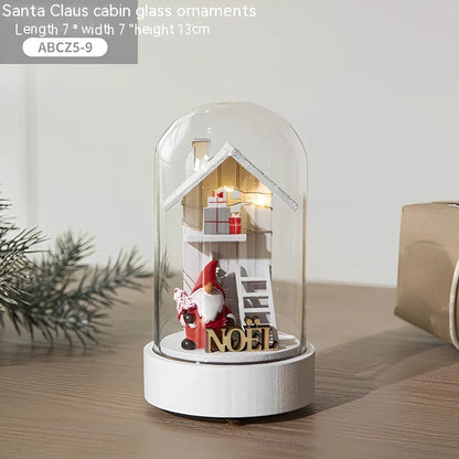 Small 15 cm glass reindeer night lamp in white snowman cabin style casting 100 lumen festive glow on table