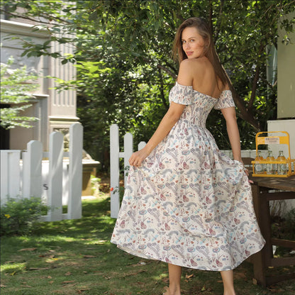Women's off shoulder strapless floral dress in a lightweight fabric, available in multiple sizes.