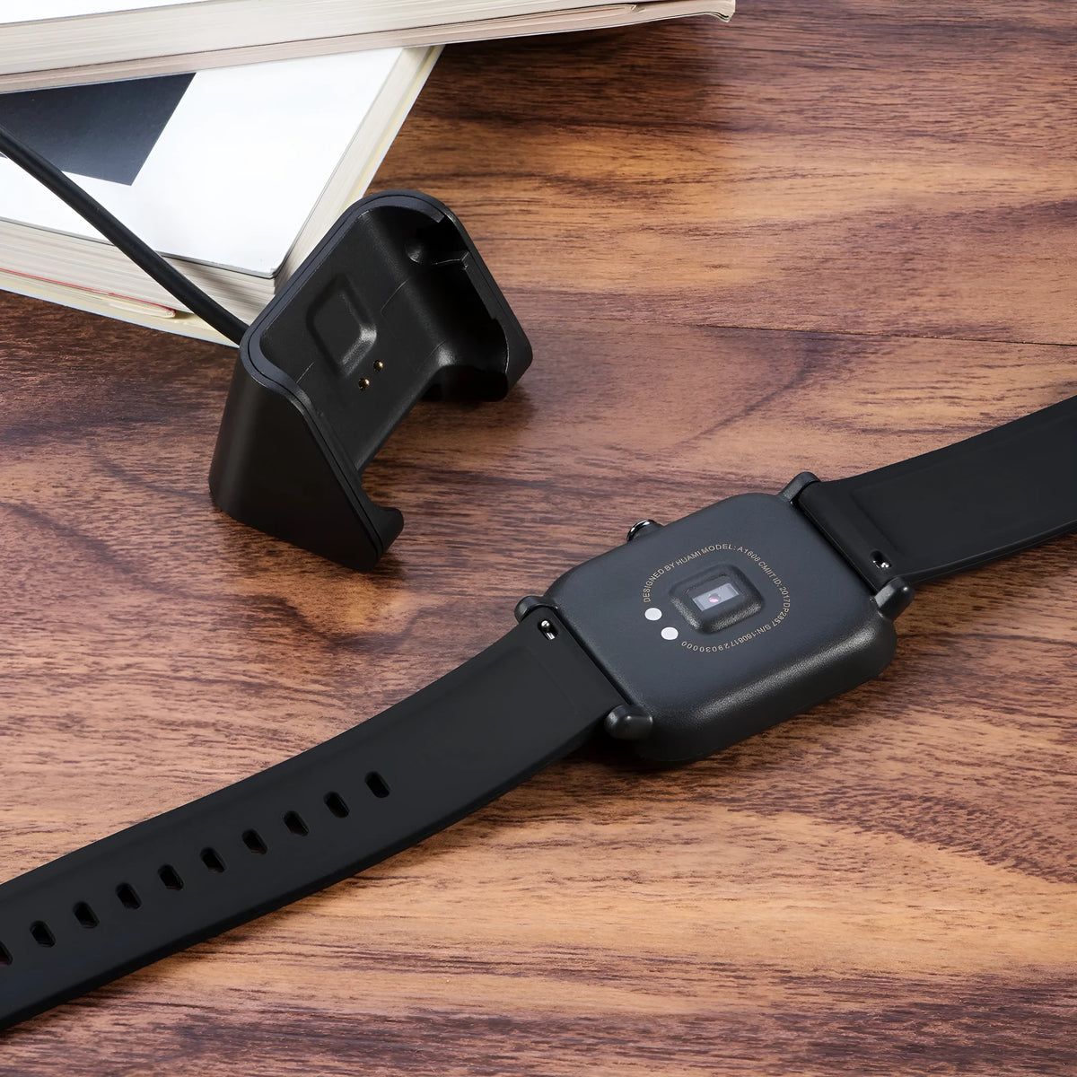 Black plastic charging cable for Youth Edition Running Smart Watch, single replacement lead