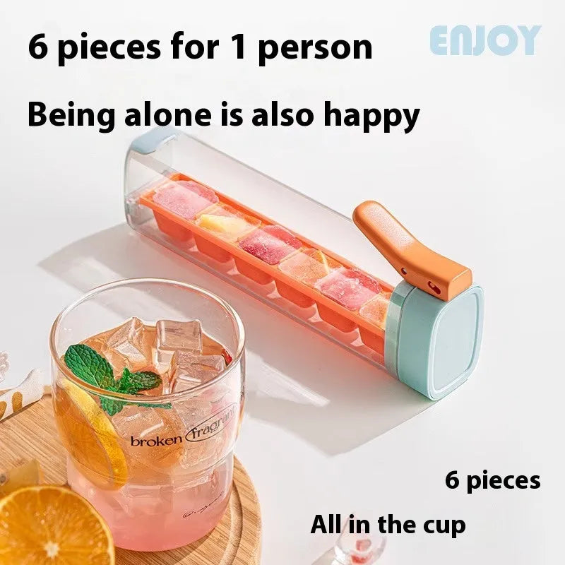 Blue press-release ice cube tray with storage box on a kitchen counter