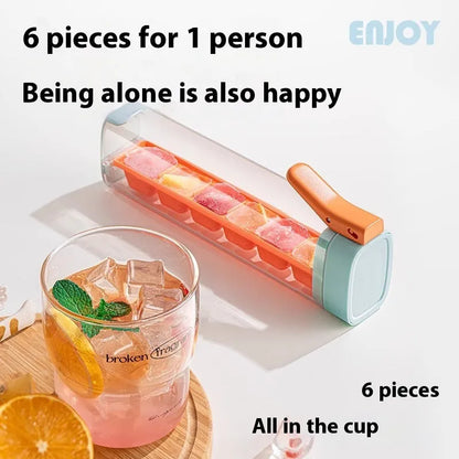 Blue press-release ice cube tray with storage box on a kitchen counter