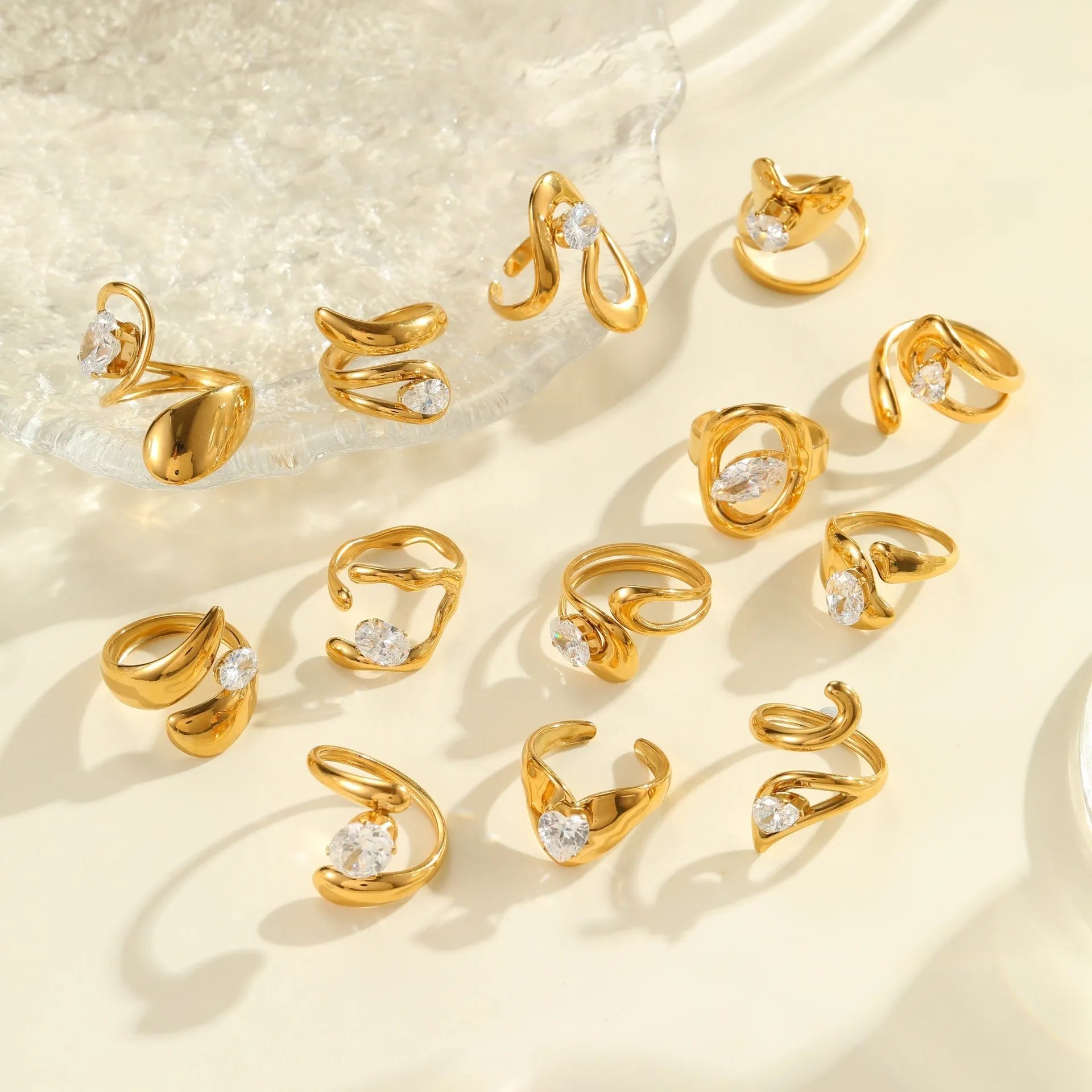 Geometric zircon ring showing round, oval and quadrangular design elements in stainless steel with electroplated finish