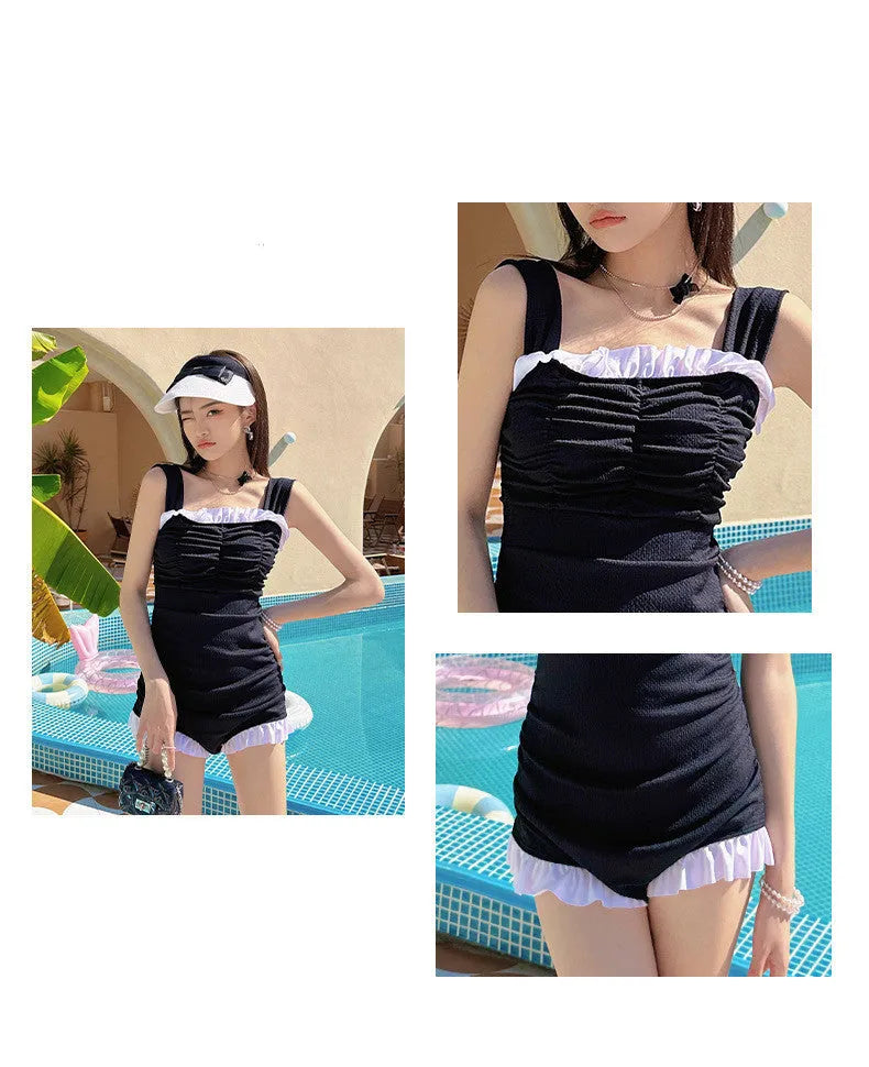 Women's solid colour one-piece swimsuit with suspender straps in pink, green, or black.