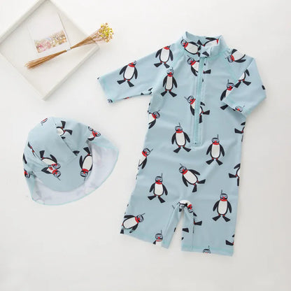 Boy's penguin print long sleeve swimsuit with matching cap for sun protection during water activities