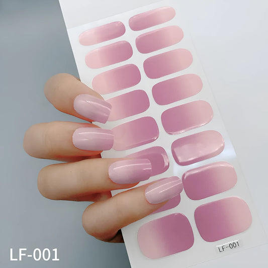 Sheet of 16 small design nail art stickers including cross, rose, tulip and marble patterns.