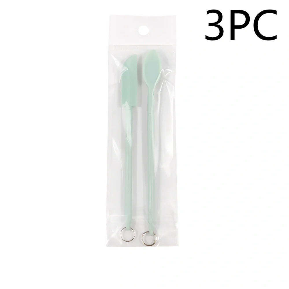 Retractable silicone cosmetic spatula extended to 15cm with scraper tool for product application