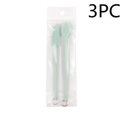 Retractable silicone cosmetic spatula extended to 15cm with scraper tool for product application