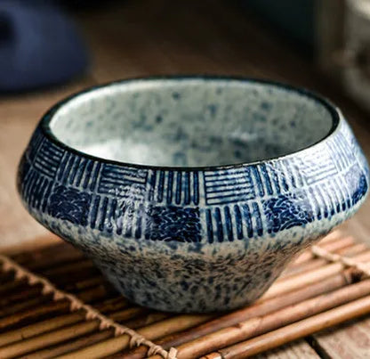 A tall porcelain soup bowl with a Japanese-inspired underglaze pattern, suitable for noodles and microwave use.