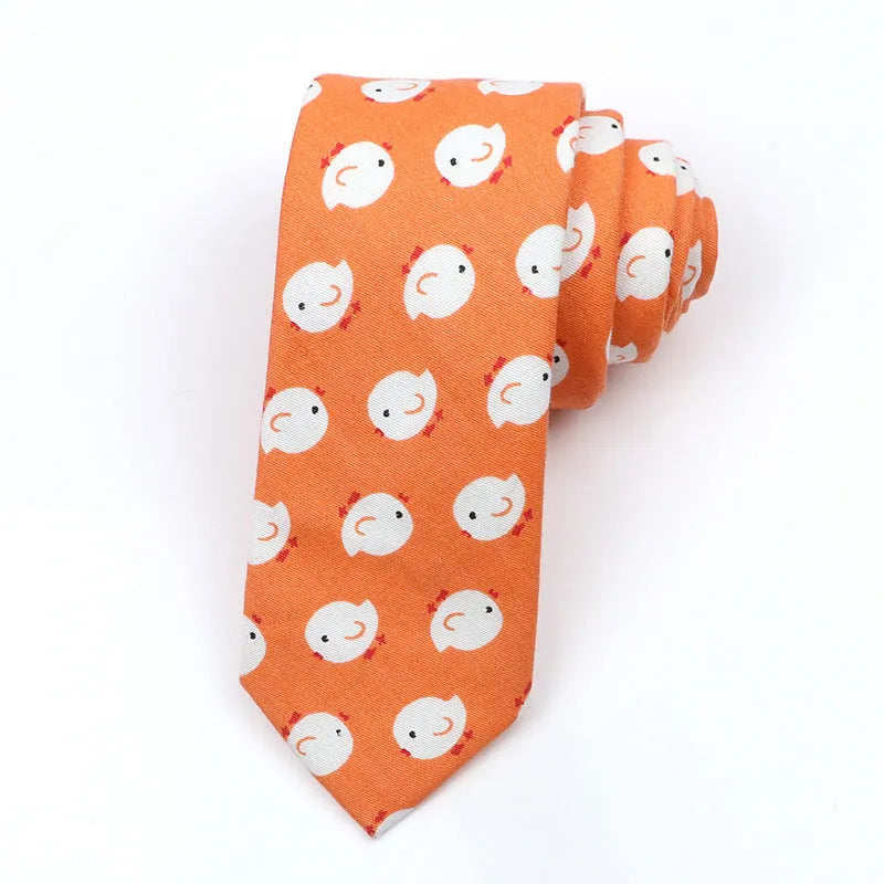 A narrow Korean-style cotton bow tie featuring a cartoon print, shown in a selection of colours.