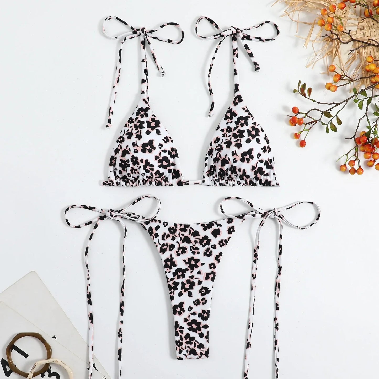 Women's split swimwear bikini set with backless design and floral pattern in available colours